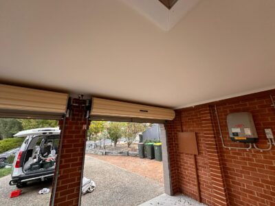 Finished garage ceiling with smooth paint and plaster in Amaroo