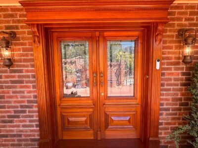 Restored and polished timber front entry door in Woden Valley, Canberra