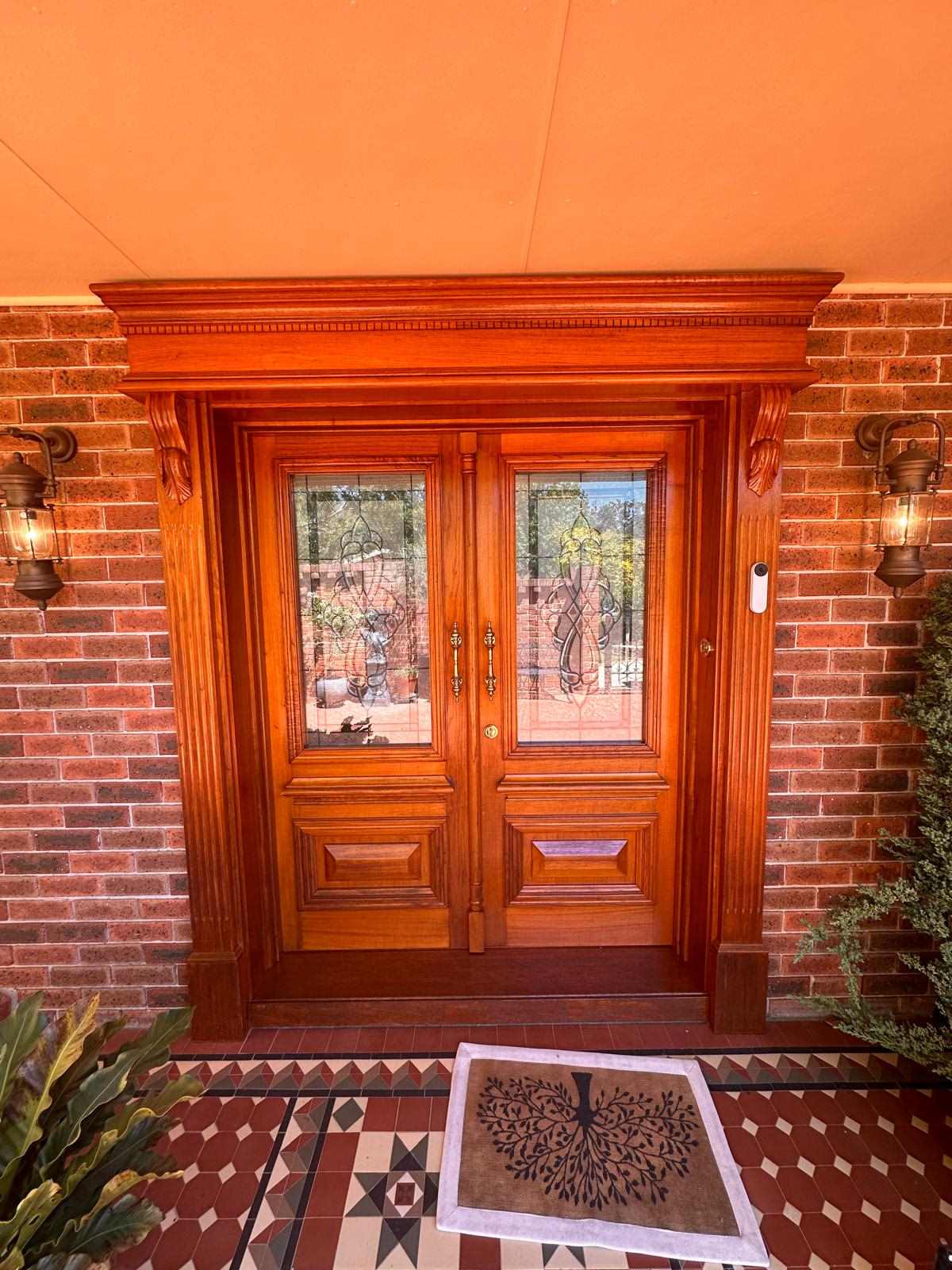 Restored and polished timber front entry door in Woden Valley, Canberra