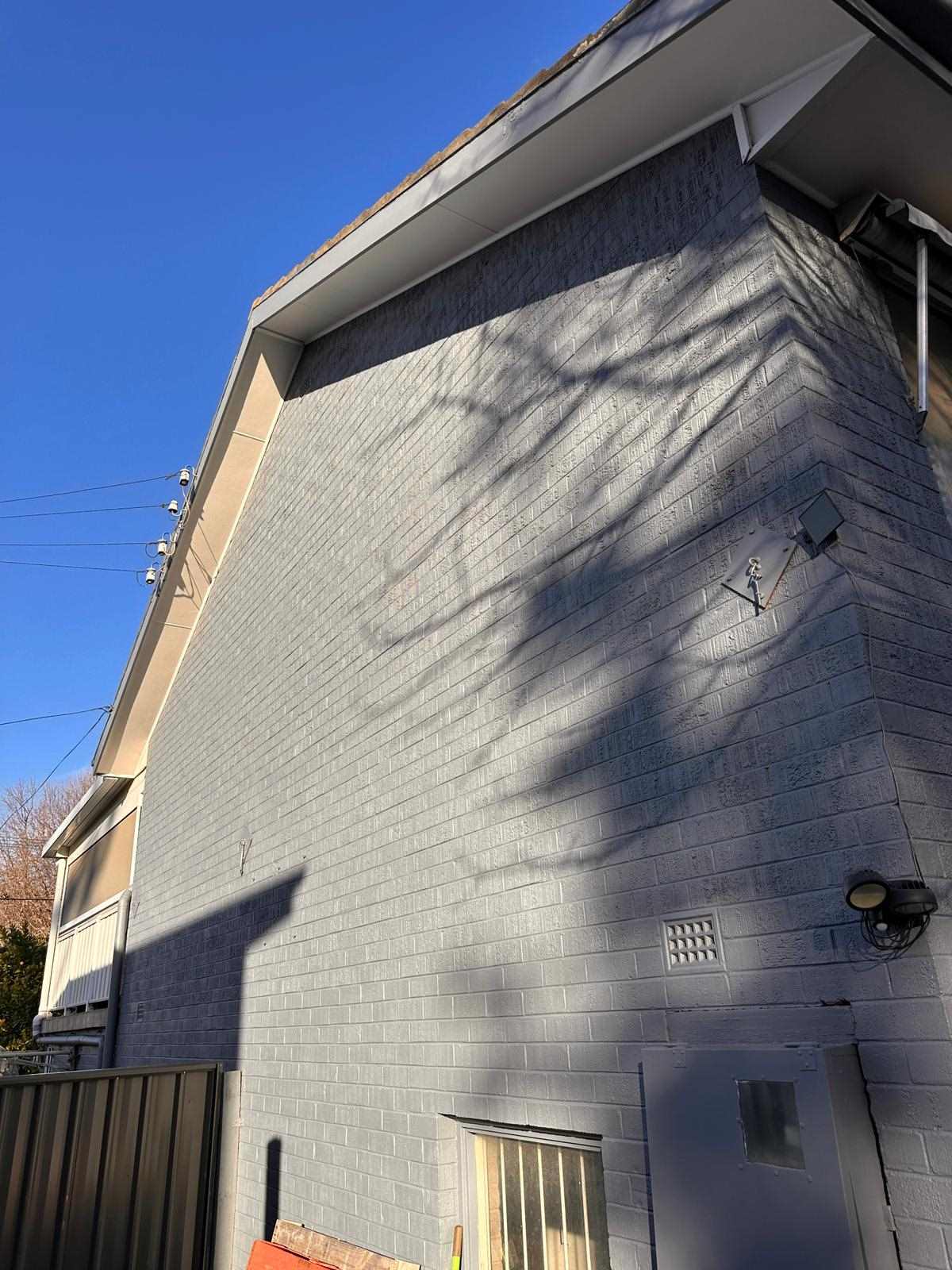 freshly painted exterior brick wall